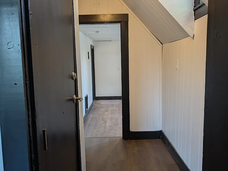 This is the main entrance hallway which includes an additional closet (not viewed in picture). The picture is taken from the master bedroom and is facing the living room. The main entrance door is on the left.