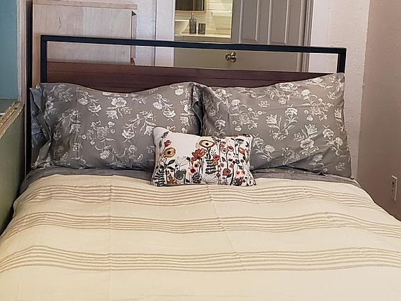 Bedroom looking into bathroom