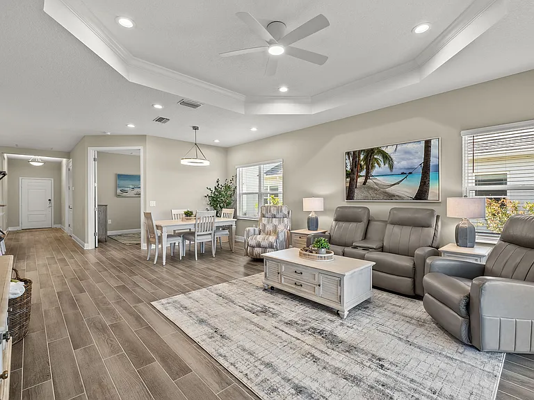 Gorgeous open living room with 2" blinds throughout and open dining room.