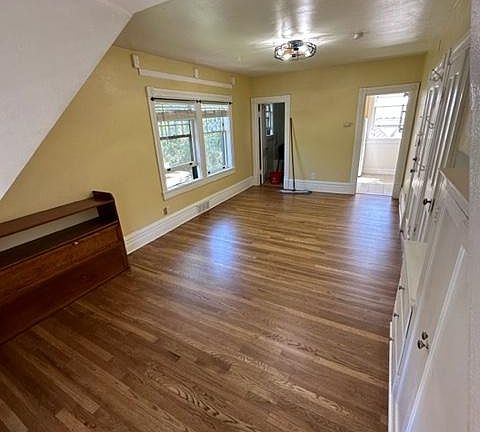 Adorable studio with ceiling fan and unique full size bed that rolls away under the wall