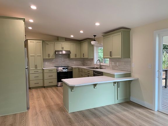 New kitchen with sliding door at right.