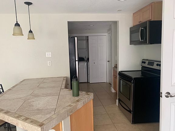 kitchen area- (included oven/stove, microwave, fridge, washer + dryer)