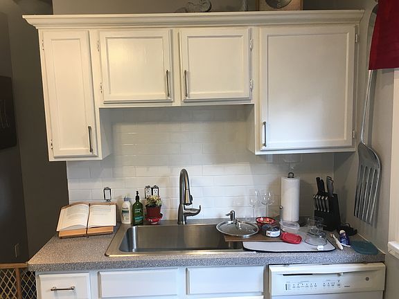New sink/backsplash/cabinets