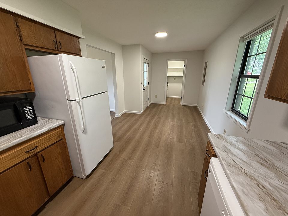 Kitchen peeking into the utility room