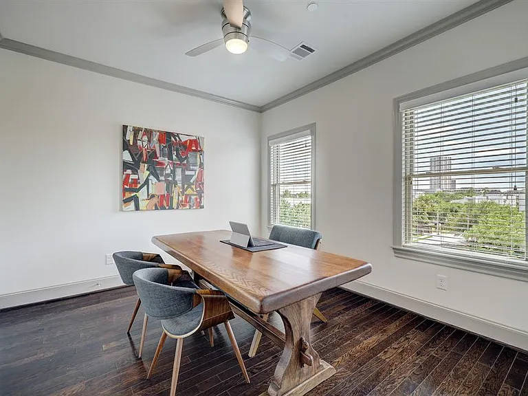 The third bedroom, located on the fourth floor, is currently being used as an office. It includes two large walk-in closets and access to the fourth-floor guest bathroom.