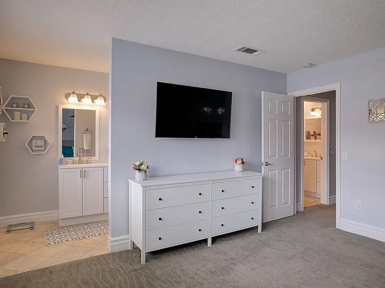 50" Roku TV in master bedroom with full bathroom.
