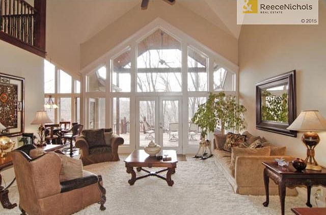 Catheral ceiling with fan, gorgous wooded view of 16 acre lot.