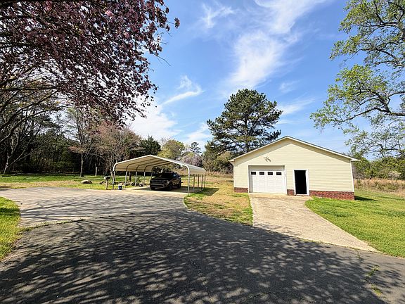 2 CARS PORT AND WORKSHOP/STORAGE