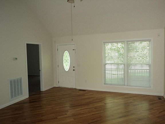 Living room with cathedral ceilings.