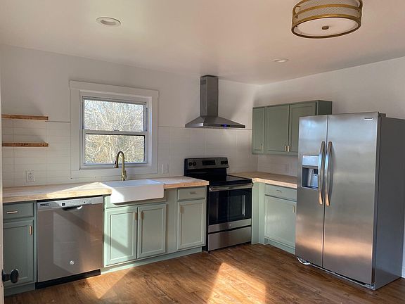 Kitchen has plenty of natural light; new cabinets and appliances