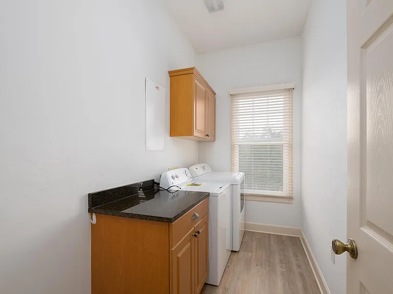 Laundry room with washer/dryer included in lease.