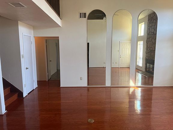 Downstair Living Room entry to garage, half bath, and master bedroom