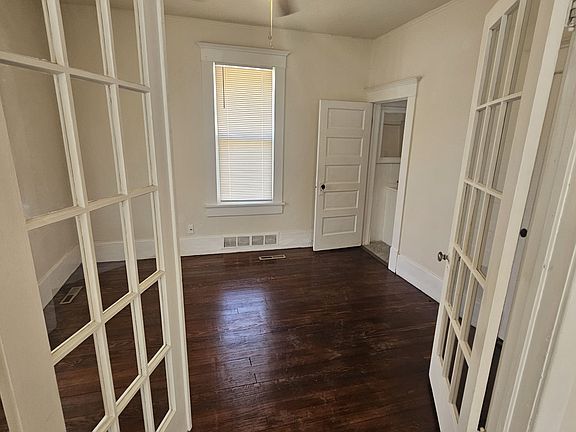 Wood flooring in this room with high ceilings. Door in back leads to the upstairs bathroom. Ther is a walk in closet in the room as well.