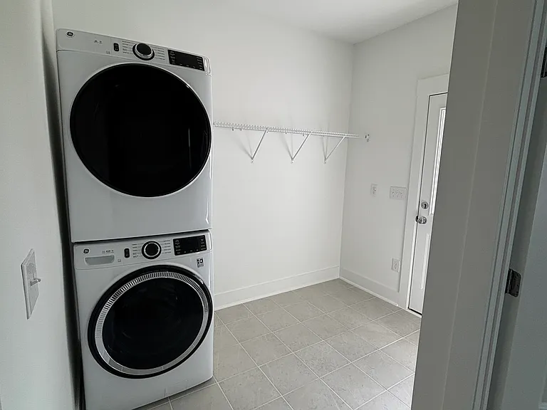 drop off area at the entry from garage; included washer and dryer; tile flooring