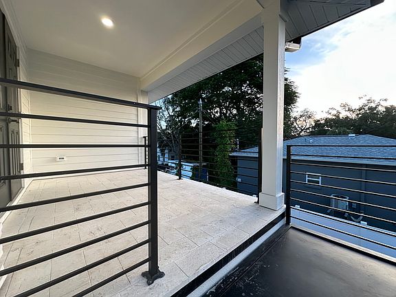 Stair landing and balcony.