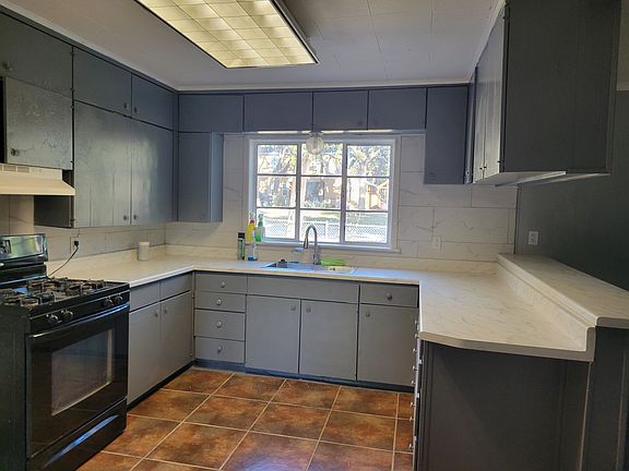 New kitchen countertop, new sink, new facet, and new paint.