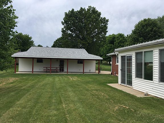 Brick house & vinyl sunroom
