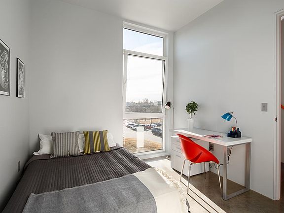 Downstairs bedroom with operable window and comes with a roller shade.