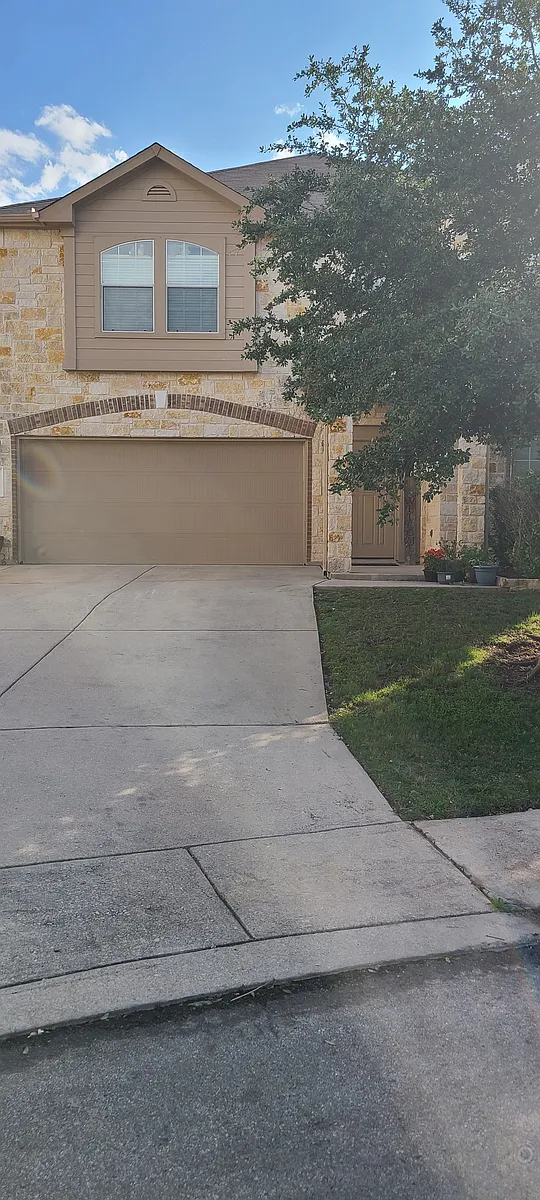 Attached 2 car garage. 2 windows are the view from master suite. - 25015 Ashe Juniper