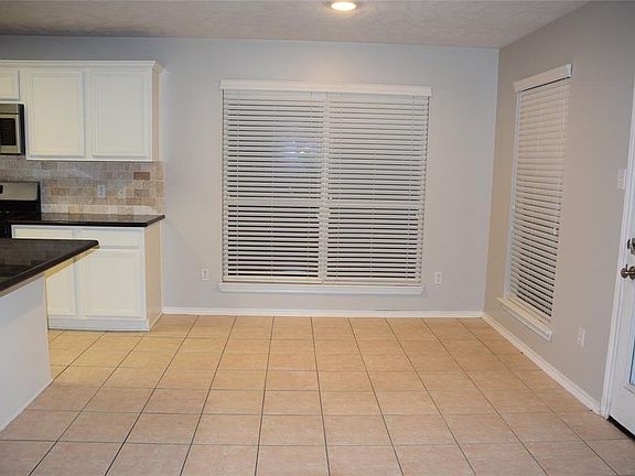 A cheery breakfast room is the perfect spot to sit and enjoy a morning cup of coffee or a quick bite to eat!