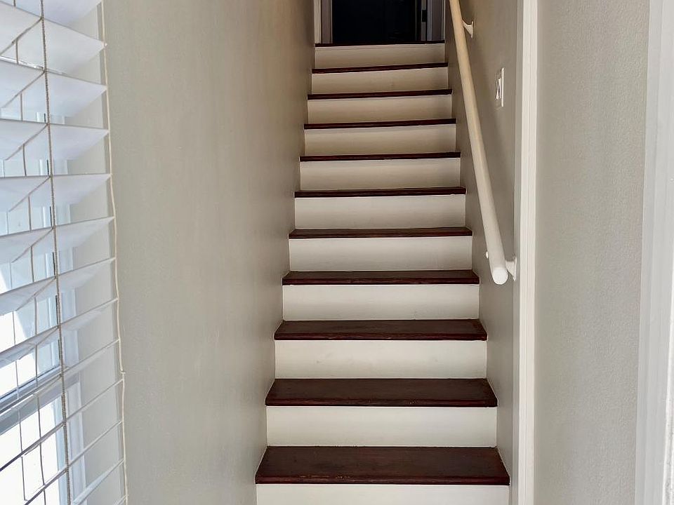 Stairs lead to the unit.