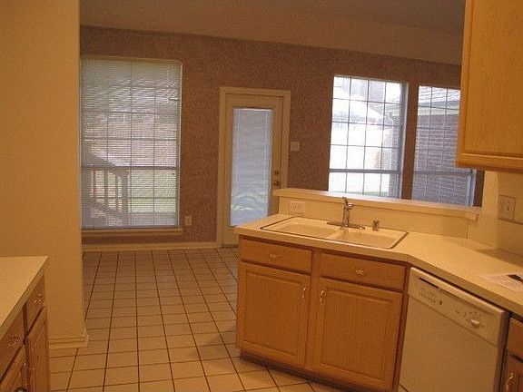 All tile kitchen and nook.  Lots of cabinets and drawer space.