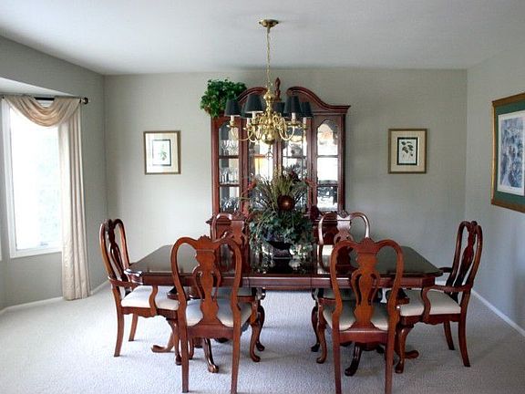 Large formal dining room with loads of light.