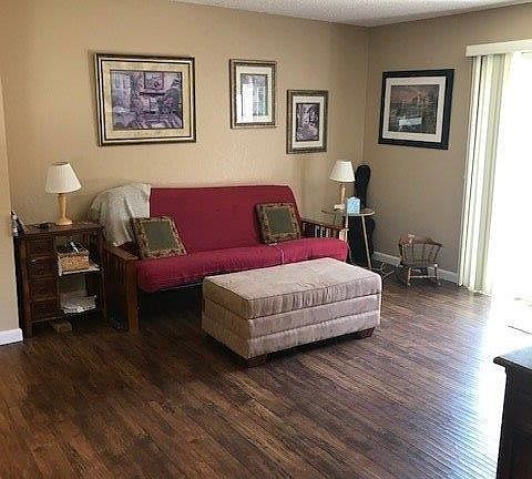 Lovely two tone paint highlights the great room with its attractive laminate flooring...