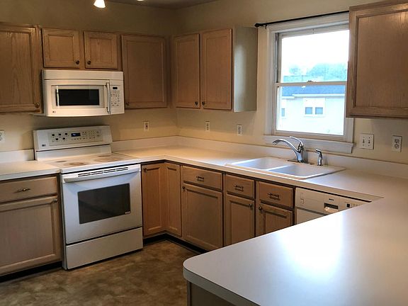 Kitchen with family too to right and dining room to left