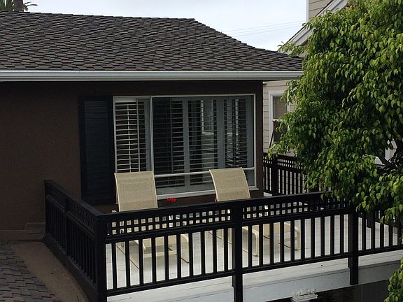 Large deck for entertainment with garden and skyline view of Fashion Island