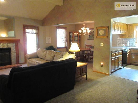 Open Floor Plan.  Great Room with vaulted ceiling opens into kitchen and dining room.  Access to covered patio.