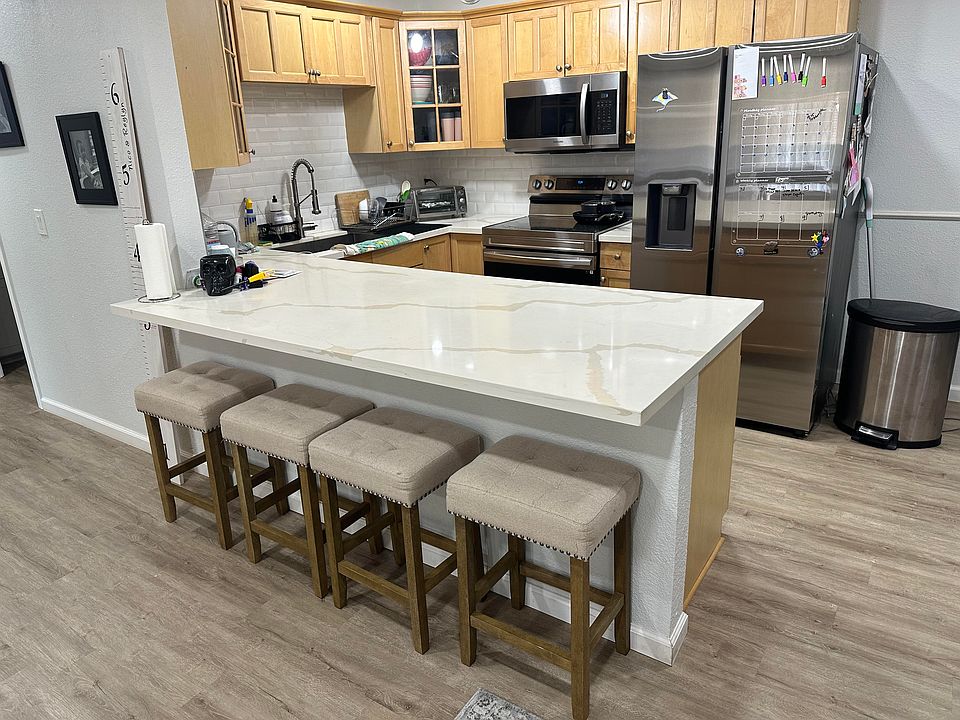 Kitchen- Newer Stainless steel appliances included. Large island that can seat 4.