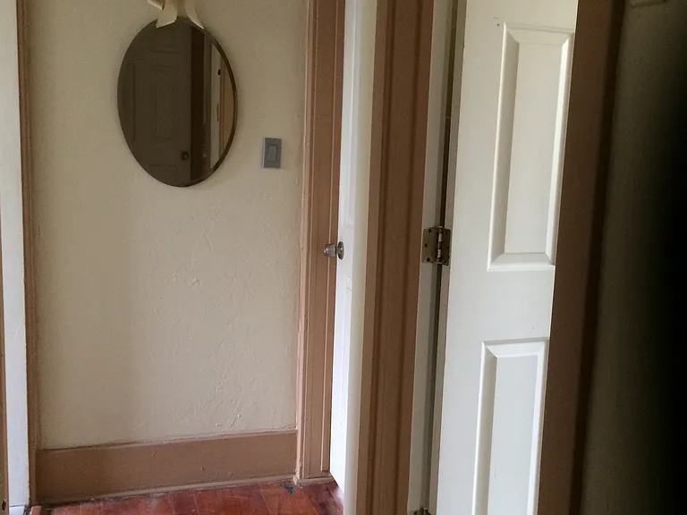 Hallway, back bedroom and bathroom on right side.