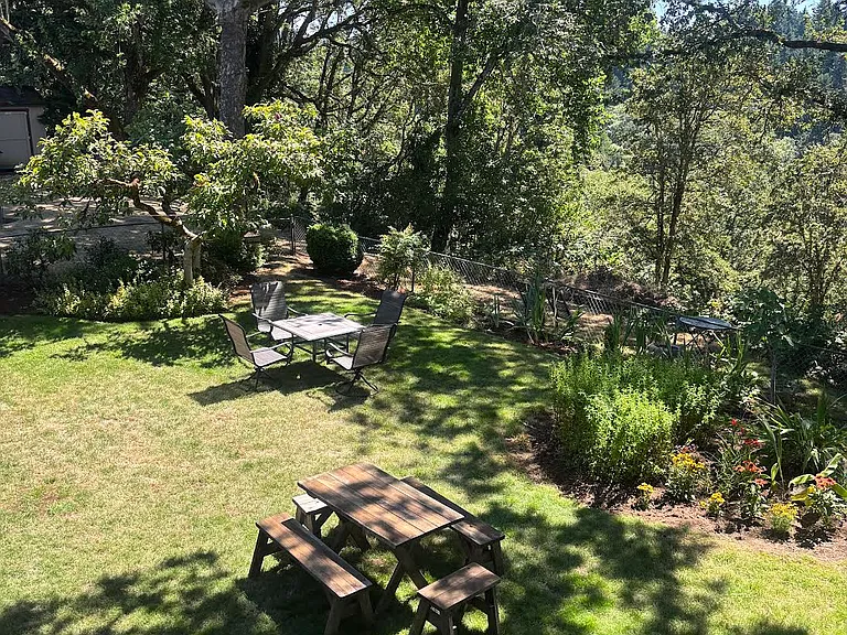 Spacious backyard on peaceful wooded lot- overlooks Burnt Bridge Creek.