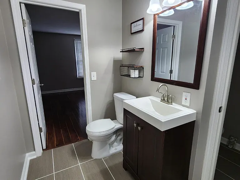 Master Bath connected to Half Bath Vanity & Toilet for guests/Bedroom 2