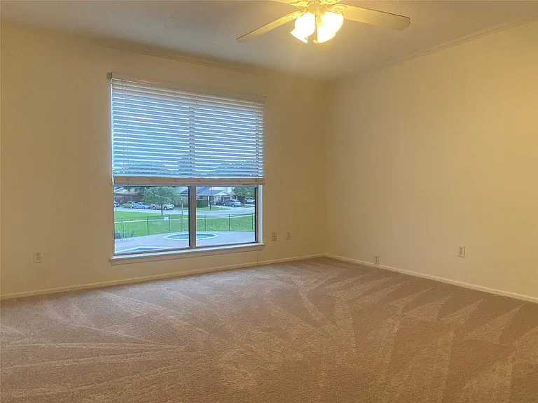 One of the large 2 bedrooms upstairs has a view of the HOA Pool.