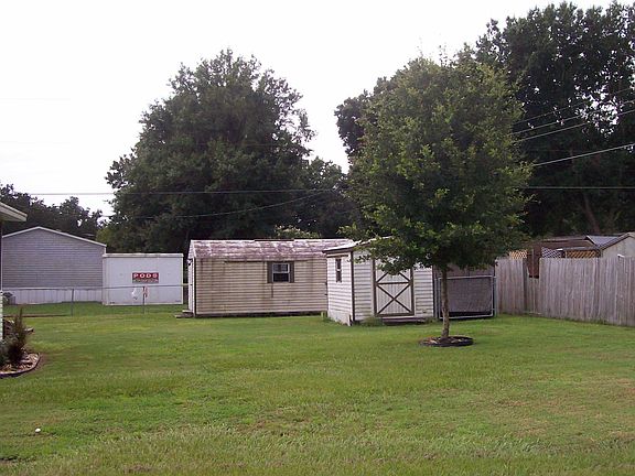 2 outbuildings in back
