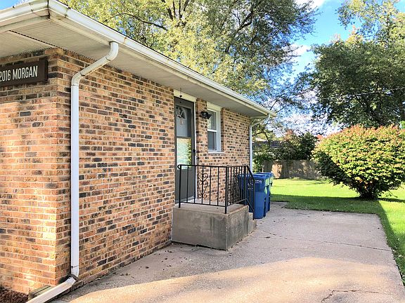 Exterior entryway with space for safely storing bins.