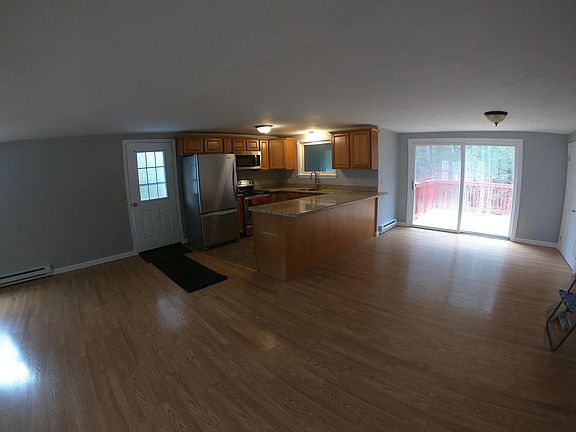 Open concept kitchen, living room, and dining area