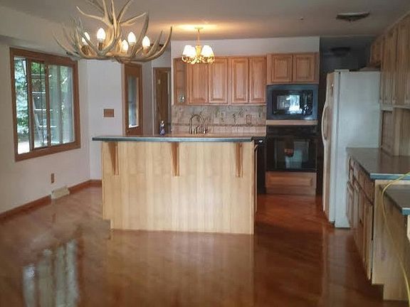 Kitchen
						:
						Solid Oak Floors, Hickory Cabinets, Antler Chandelier.