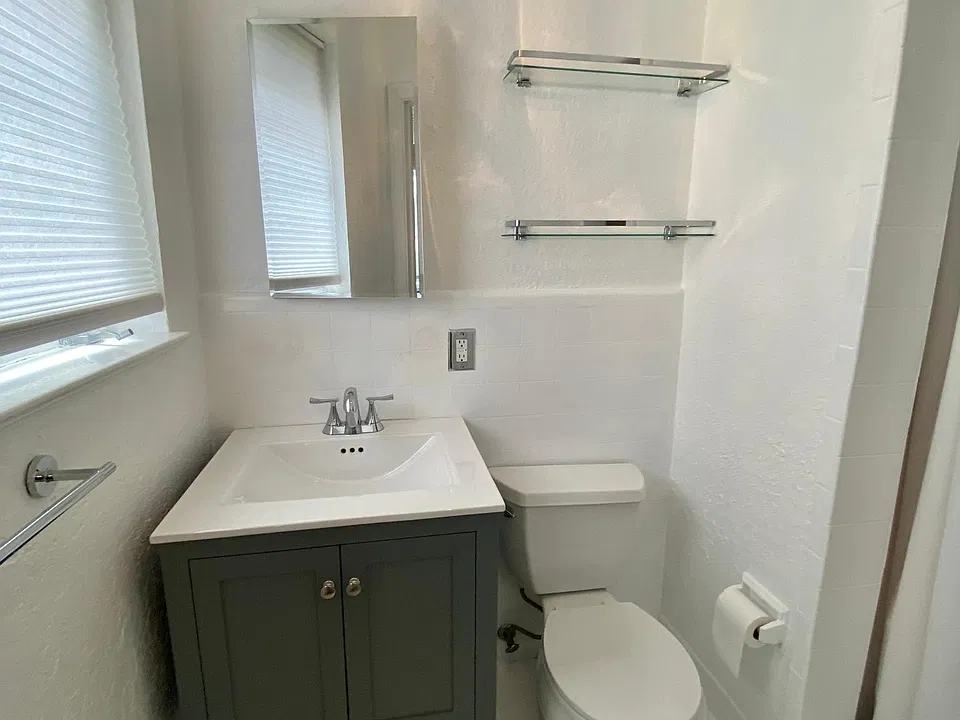 Clean and neat bathroom with standup shower (no tub.)