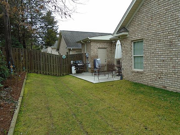 Back patio and fenced yard