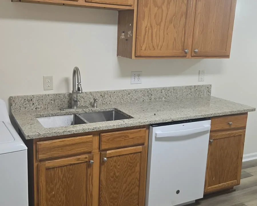 New faucet and marble countertops.