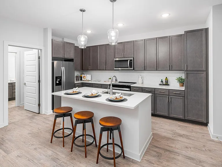 Model Kitchen with Espresso Cabinetry and Stainless Steel Appliances