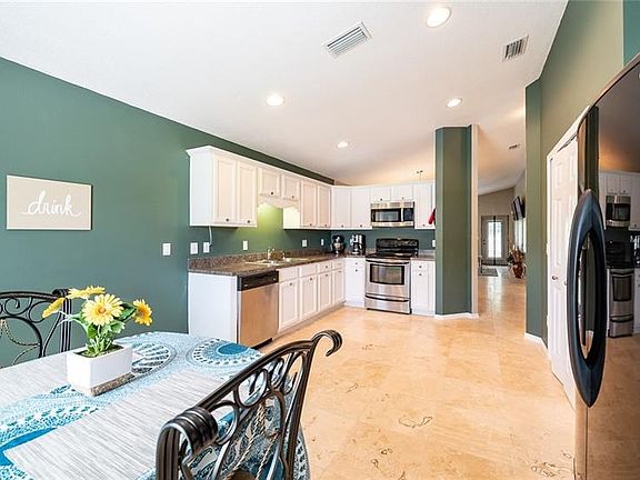 Eat-in Kitchen with recessed lighting and large pantry