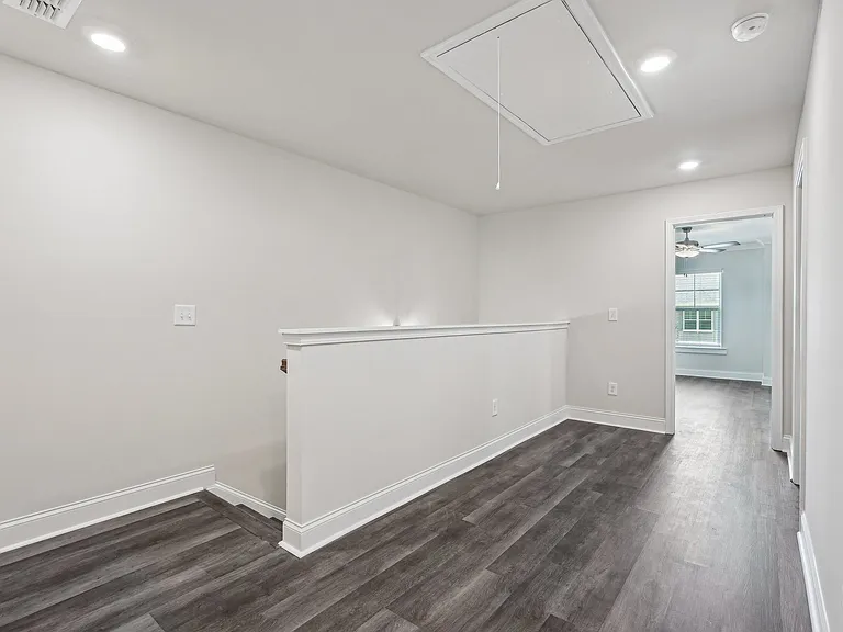 Loft area ideal for family gatherings just steps from the upstairs bedrooms.