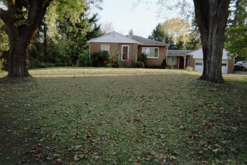 Front view of house and beautiful yard and trees
