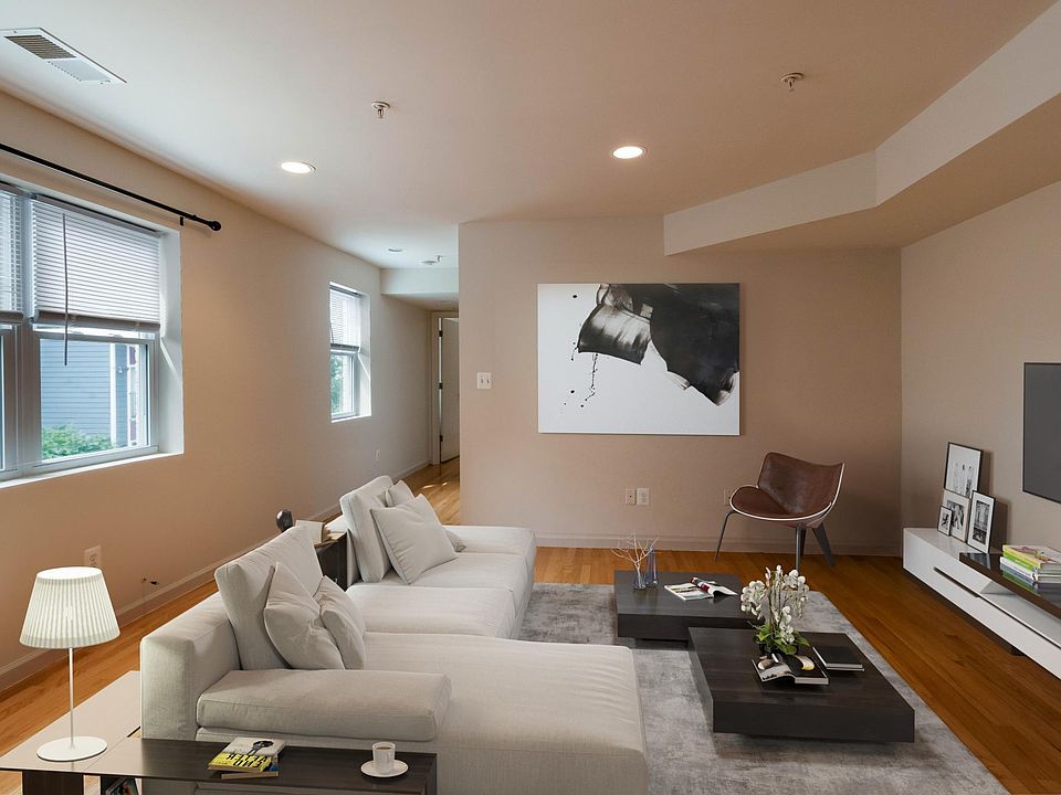 Den (virtually staged). Great light--windows are West facing.