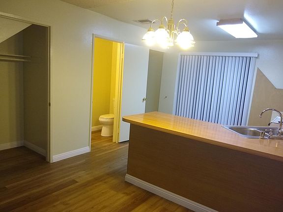 First door is the closet/storage under the stairs Second door is a half bathroom Third door is the laundry room