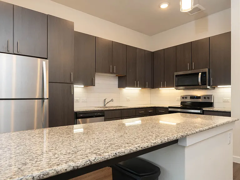 Kitchen with Stainless Steel Appliances and Breakfast Bar